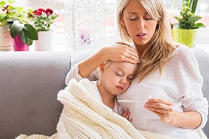 a woman holding a baby